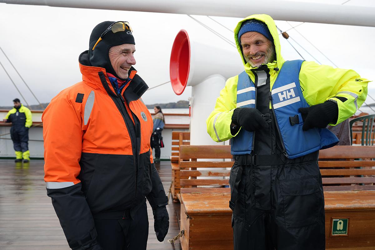 Two persons standing on the deck